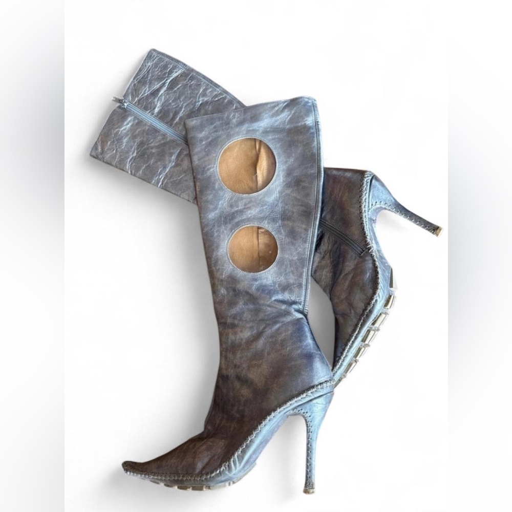 Shelly’s Silver leather knee-high boots with cut-out details and high heel.